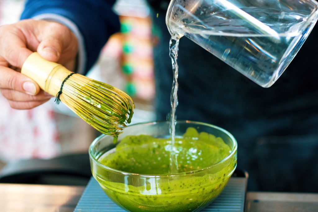 making matcha tea water whisk